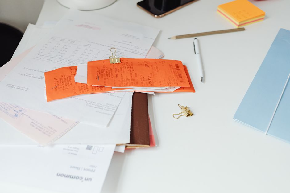 Receipts and documents arranged on a desk